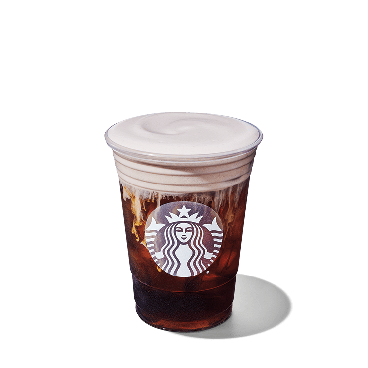 The image shows a clear plastic cup filled with iced coffee, topped with a creamy foam layer. The cup features the Starbucks logo prominently on the front.